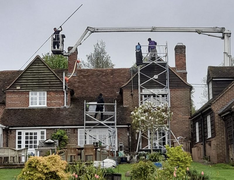 The Roof Moss Cleaners using cherry picker and scaffolding to clean roof safely and professionally in Oxford, Oxfordshire