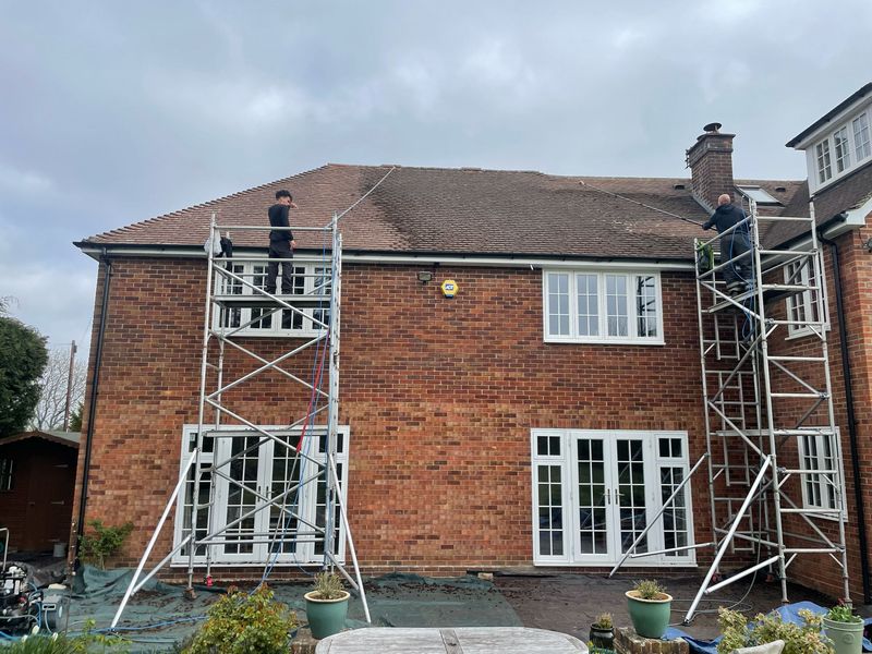 Roof cleaning carried out safely from scaffold towers by The Roof Moss Cleaners in Oxford